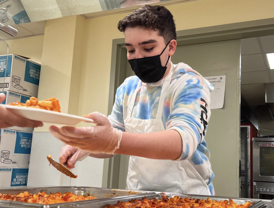 Here I am scoopin’ up the best cuts of baked ziti for my best friends.
