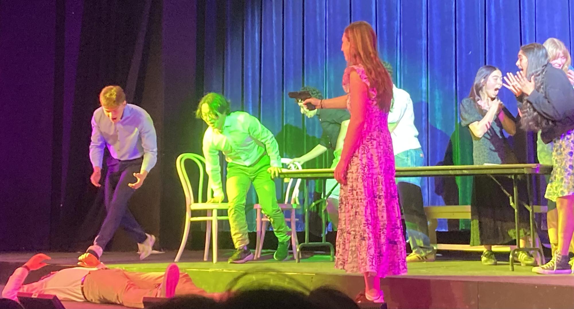 Hale McGivern ’25 reveals herself as the murderer in a Spanish V Honors play. (Staff Photo by Gabe Cooper)