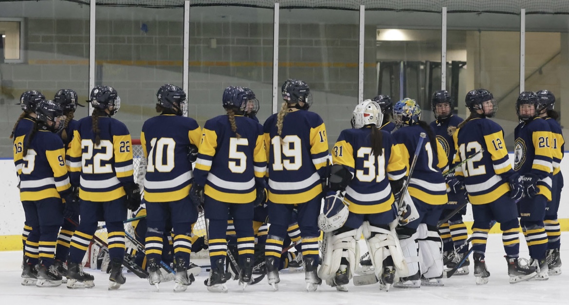 GVH holds a team meeting on the ice during a game. (Photo Courtesy of Ace Van Vliet)