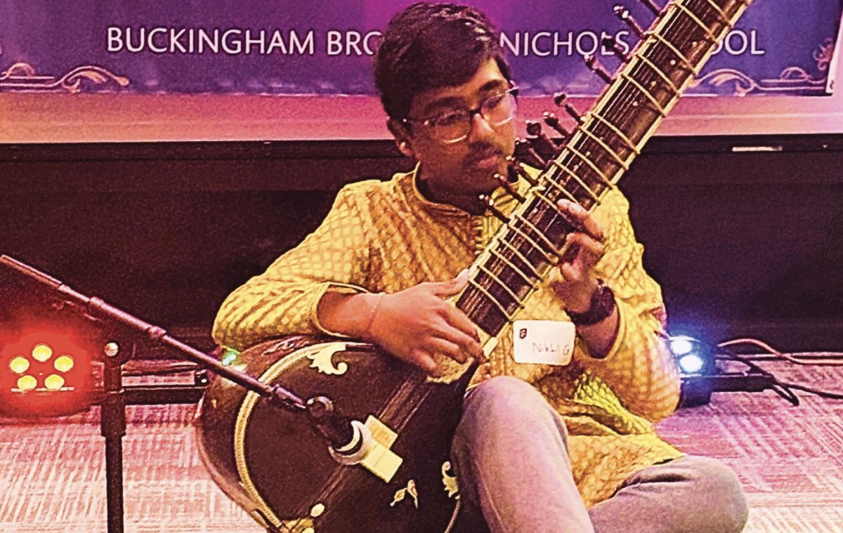 Nikhil Govindaswamy ’29 plays the sitar at Knight of Lights. (Photo Courtesy of Scarlett Hawkins)