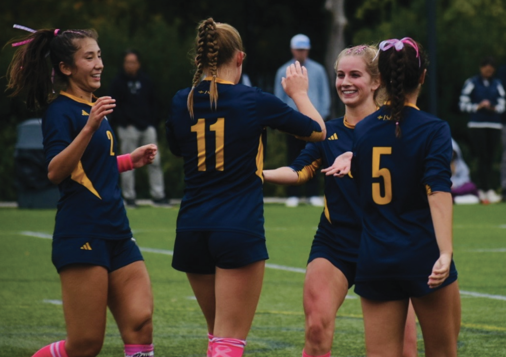 Left to right: Addy Kalaw ’26, Alysse Schmidt ’29, Hope McMillin and Aubrielle Amaral (both ’26) celebrate a goal against St. Mark’s. (Staff Photo by Azariah Zewde)