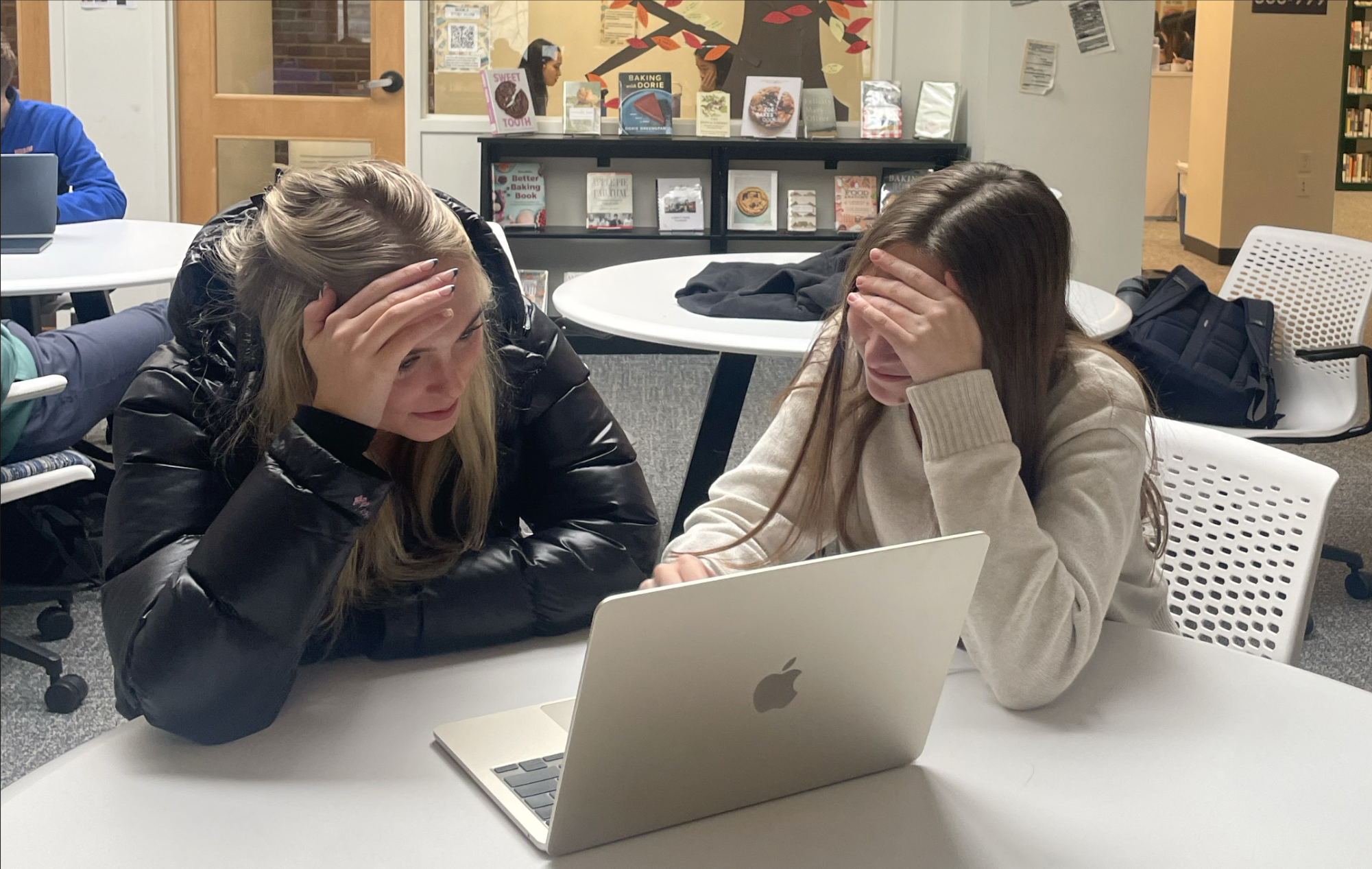 Jordan Price and Charlotte Pojasek (both ’27) work on their computer in the US Almy Library. (Staff Photo by Katy Varadi)