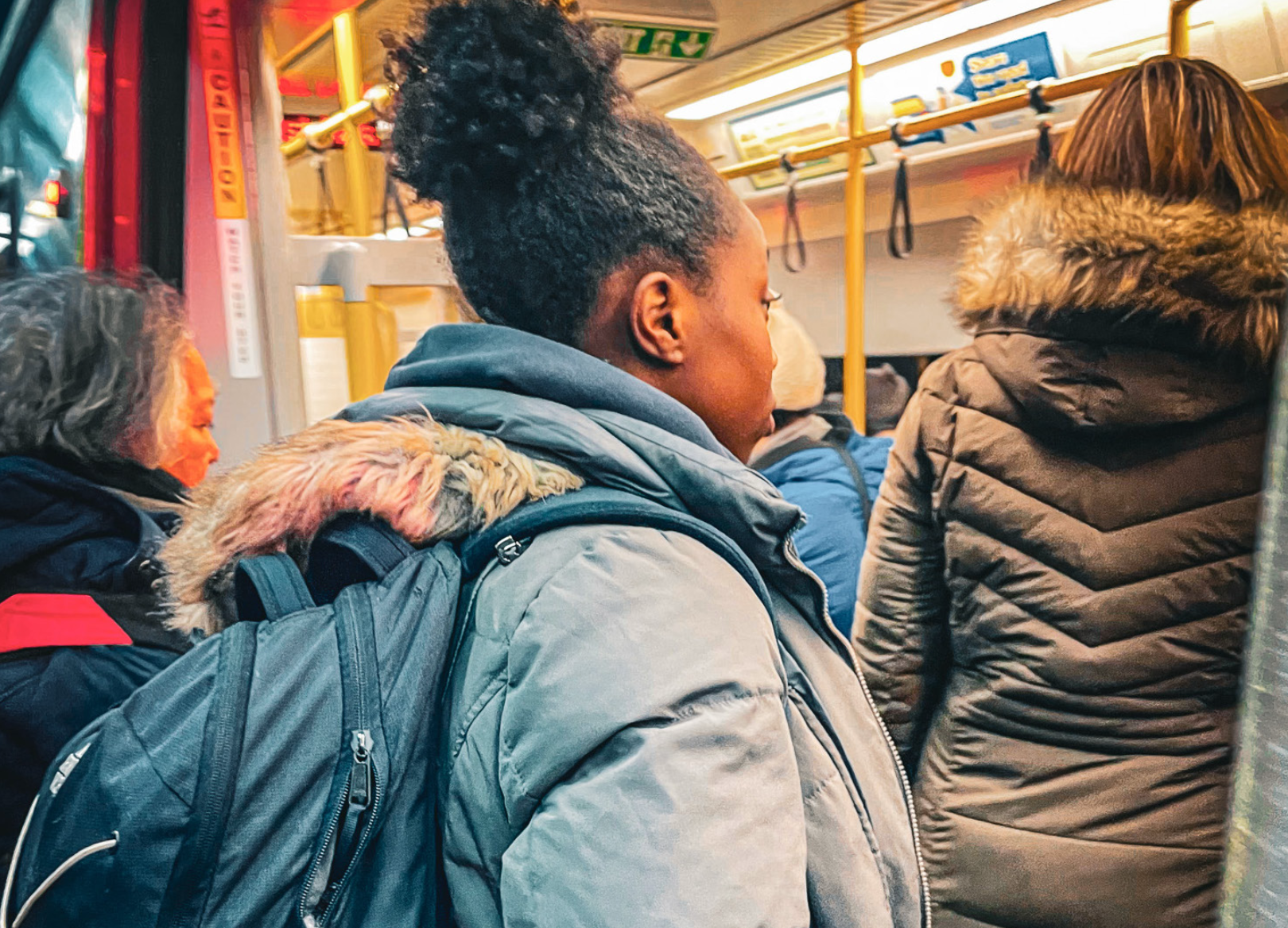 Princess Adeoye ’27 boards the T at the Harvard station. (Staff Photo by Katy Varadi)