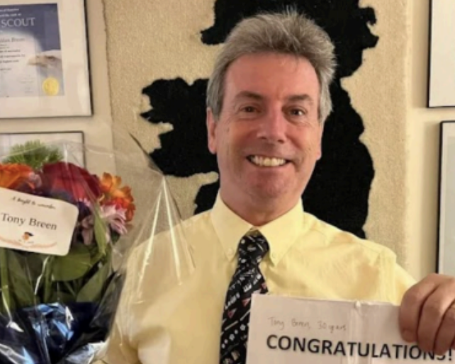 Dr. Breen is celebrated with flowers after reaching 30 years at the MS.