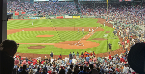 The Fenway crowd watches the Red Sox play while many sit out due to injury.