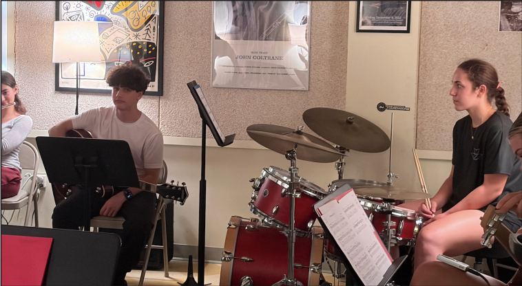Left to right: Mattia Farmer, Jonathan Harlev, Valor McGrath and Sarah Baker (all ’27) play instruments for their weekly Jazz Band practice after school. Valor, like many other student-athletes who play instruments, came
straight from her Varsity Volleyball practice.